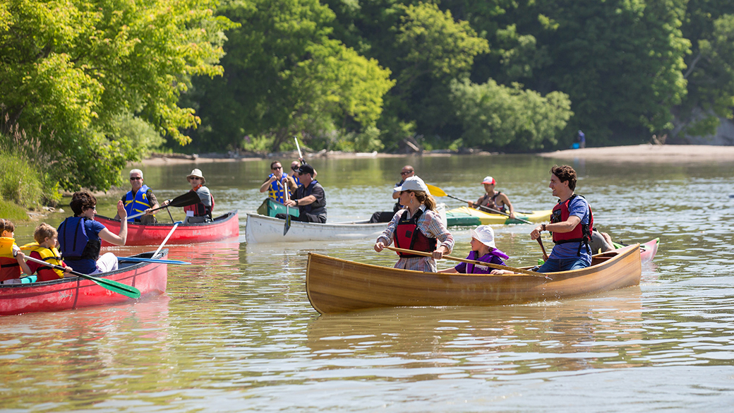 Prime Minister Justin Trudeau, Sophie Grégoire Trudeau and their daughter Ella-Grace, along with other people, canoe on the Rouge River in Ontario.