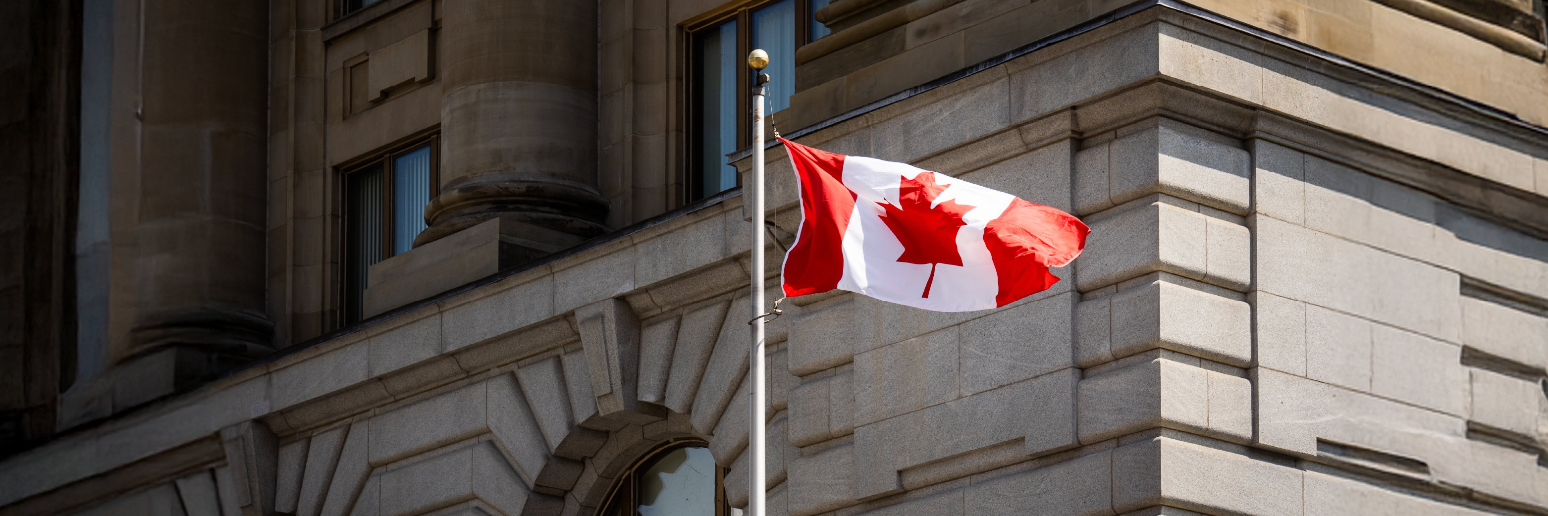 Canadian flag in front of 80 Wellington