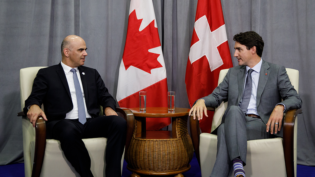 PM Trudeau sits and talks with President Alain Berset