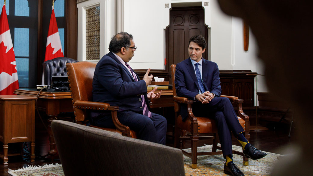 Prime Minister Justin Trudeau sits with Calgary Mayor Naheed Nenshi