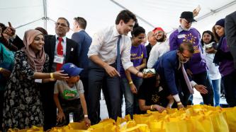 Photo number 1 from the photo gallery Prime Minister Justin Trudeau helps pack food baskets with Project Ramadan in Scarborough, Ontario