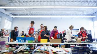 Photo number 1 from the photo gallery Prime Minister Justin Trudeau packs backpacks for the new school year at the Salvation Army in Goderich, Ontario