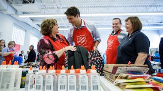 Photo number 3 from the photo gallery Prime Minister Justin Trudeau packs backpacks for the new school year at the Salvation Army in Goderich, Ontario