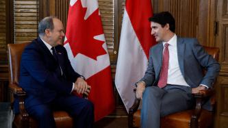 Prime Minister Justin Trudeau sits and talks with Prince Albert of Monaco in his office 