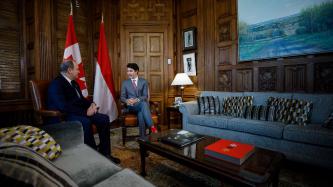 Prime Minister Justin Trudeau sits and talks with Prince Albert of Monaco in his office 