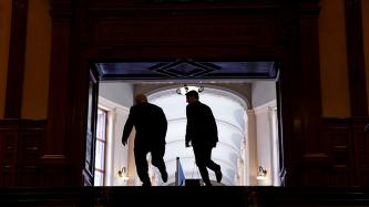 Prime Minister Justin Trudeau and Ontario Premier Doug Ford ascend stairs at the Legislative Library in Toronto.