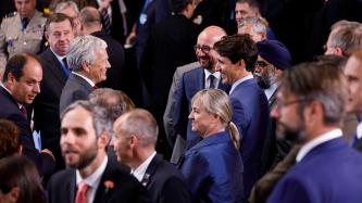 Prime Minister Trudeau talks with other NATO leaders.