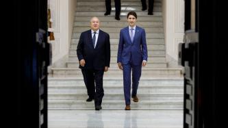 PM Trudeau and President Sarkissian walk down a set of stairs