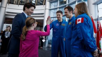 Ella-Grace high fives astronaut Jeremy Hansen