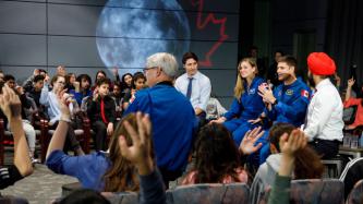 Astronaut Jeremy Hansen speaks to the crowd during a panel