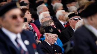 A veteran in sorrow sits in the audience