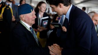 PM Trudeau speaks with a veteran