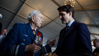 PM Trudeau speaks with a Canadian veteran