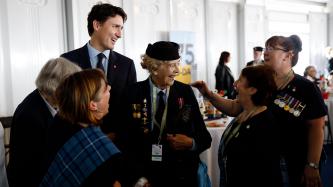 PM Trudeau speaks with a group of women