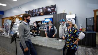 Prime Minister Trudeau speaks with customers and employees