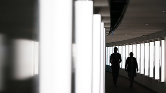 Silhouettes of Prime Minister Justin Trudeau and Ms. Mary Simon in a corridor