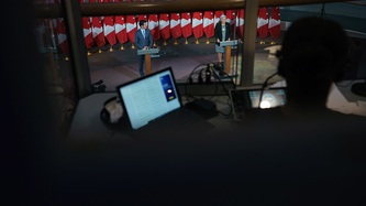 A bird’s eye view of PM Justin Trudeau and Ms. Mary Simon at podiums from a technicians booth