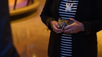 Ms. Mary Simon holds an object in her hands