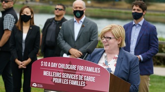 Minister Qualtrough speaks at the podium