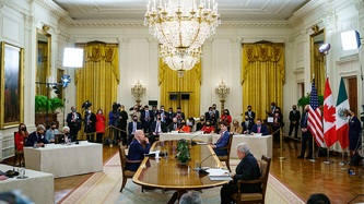 President of Mexico, Andrés Manuel López Obrador, U.S. Pres. Biden, and PM Trudeau sit at a table