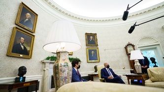 Microphones hang above President Biden and Prime Minister Trudeau in the Oval Office