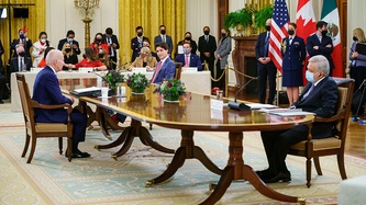 President of Mexico, Andrés Manuel López Obrador, U.S. Pres. Biden, and PM Trudeau sit at a table